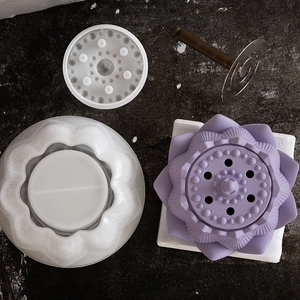 Macro detail of lotus silicone mold with multi-layered petals and DIY casting tool
