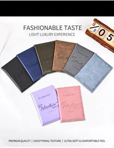 Collection of colorful PU leather passport covers featuring engraved adventure quotes