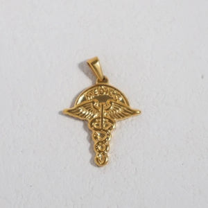 Close-up of golden stainless steel Caduceus medical pendant with MEDICO engraving