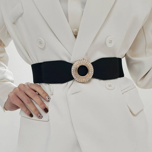 Women elastic waist belt with sparkling rhinestone round buckle on white blazer