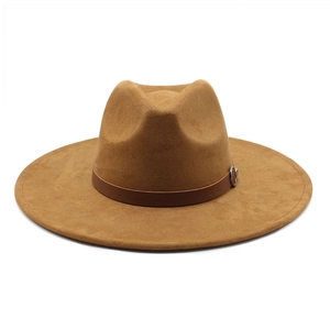 Close-up of camel wool fedora hat featuring a leather band and silver buckle detail