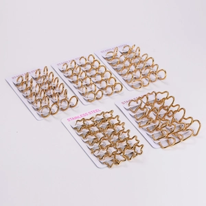 Golden stainless steel earring set featuring circle, heart, and star geometric designs