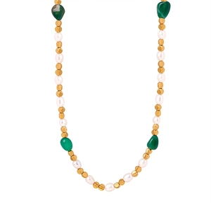 Vintage style necklace with baroque pearls, green natural stones and golden beads on white back