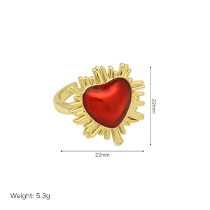 Detail shot of golden heart ring with rays showing 22mm dimensions and 5.3g weight