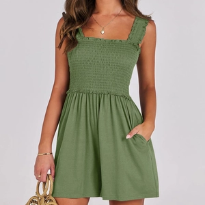 Elegant sage green strapless jumpsuit with smocked bodice and wide leg summer design