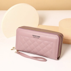 Pink quilted double zipper wallet with wrist strap and diamond stitching detail