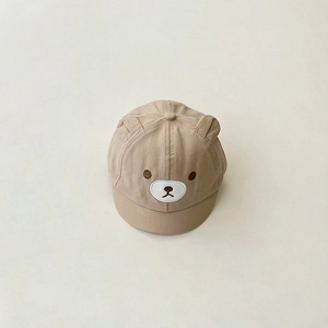 Detail of baby soft brim cap featuring cute 3D ears and embroidered bear face design