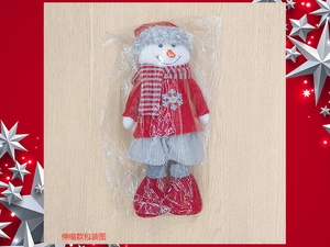 Retractable Christmas snowman doll in red knit sweater packaged in a clear protective bag