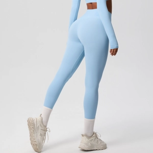 Rear view of light blue high-waisted yoga leggings and long sleeve sports top set