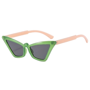 Modern cat-eye sunglasses with translucent green frames and pink temples in a minimalist style