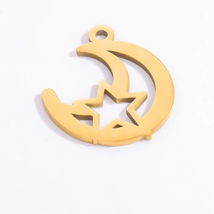 Detailed view of hollow moon and star DIY pendant in 18k gold plated stainless steel