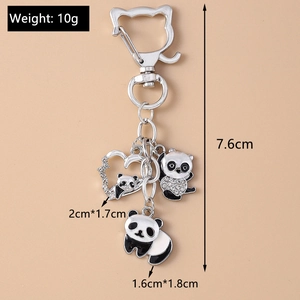 Detail view of rhinestone panda keychains with dimensions and weight measurements