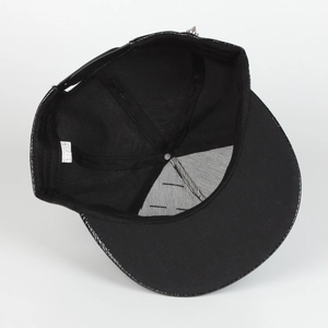 Detail of black faux crocodile leather hip-hop cap showing inner structure and snapback