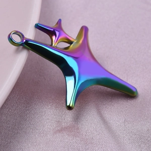 Macro shot of 18k gold plated stainless steel starfish pendant with iridescent finish