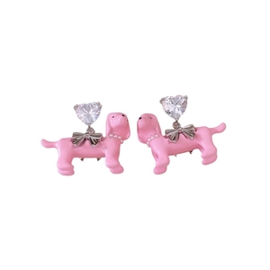 Pink puppy stud earrings with silver bows, pearls, and heart-shaped cubic zirconia stones