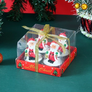 Detailed view of Christmas Santa Claus candle gift set with festive gold ribbon and red base