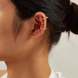 Set of four gold-plated 925 silver ear cuffs featuring twisted and smooth minimalist designs