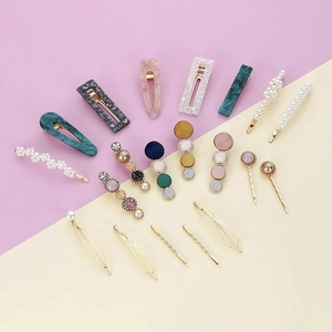 Detailed set of marble texture and pearl hair clips in assorted candy colors for women