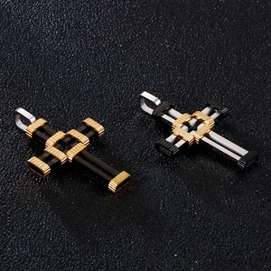 Detailed view of mechanical hollow cross pendants in gold, silver, and black finishes