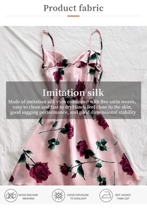 Detailed view of imitation silk fabric with elegant pink rose print and high drape quality