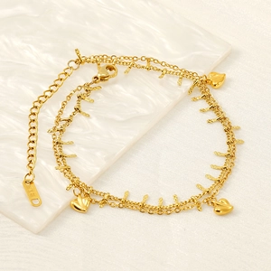 Elegant 18K gold-plated double-layer anklet featuring heart charms and feather tassels