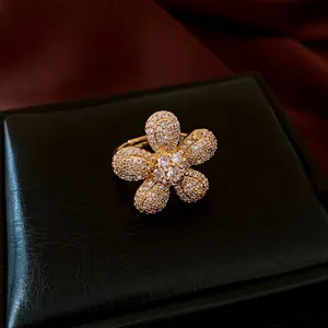 Vintage zircon flower open ring with 18K gold plating and pavé setting on dark leather