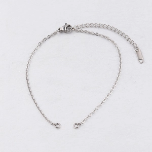 Detail of 2mm silver stainless steel chain with lobster clasp and metal tag