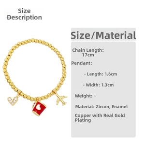 Detail of beaded bracelet showing gold plane, red mug and zircon heart charms size info