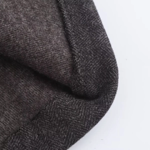 Deep grey knitted wool blend A-line midi skirt with detailed texture and matching belt