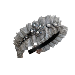 Silver pleated fabric headband with large clover-shaped grey crystals and rhinestones