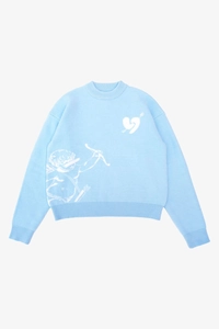 Dettaglio della trama a maglia jacquard Cupido sul maglione Y2K azzurro chiaro