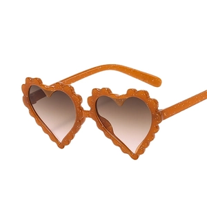 Glitter orange heart-shaped sunglasses for kids with wavy frames and gradient lenses
