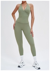 Detail view of olive green halter yoga vest and high-waist leggings set on fitness model