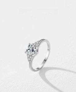 Macro detail of a 925 sterling silver ring with a heart-shaped brilliant cut diamond
