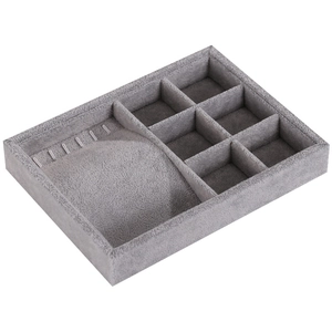 Gray velvet jewelry tray with multi-compartment organizers and ring slots