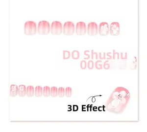 Macro detail of 3D embossed white floral accents on pink gradient press-on nails