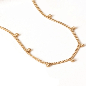 18K gold-plated stainless steel chain necklace with minimalist metal beads on white background