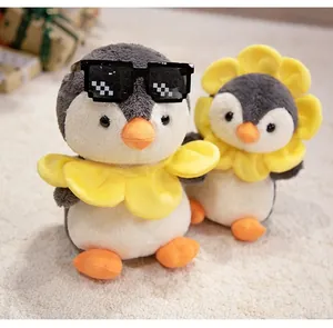 Detailed view of plush penguin toys with sunflower headgear and pixel sunglasses on a rug