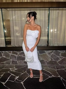 Sleek white strapless bodycon midi dress with 3D flower detail and ruched fabric