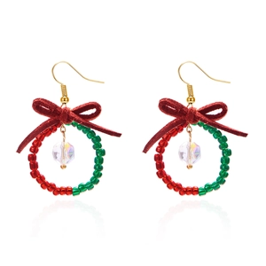 Elegant Christmas wreath earrings with red velvet bow and crystal drop on white background