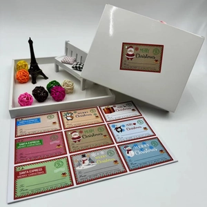 Close-up of assorted Christmas gift stickers with Santa and snowman on gift boxes