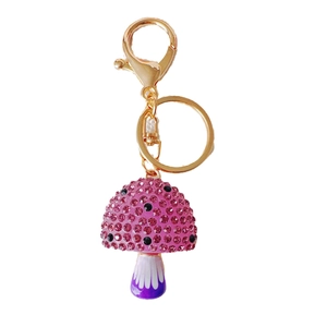 Cute mushroom keychain with pink rhinestones and purple enamel on gold metal ring
