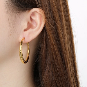 Polished 18k gold plated hoop earrings with textured stripe pattern for women