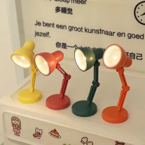 Mini lampes de bureau LED pliables en quatre couleurs avec bras articulé et base ronde