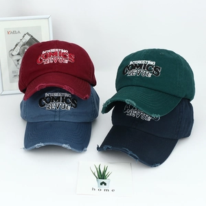 Detail of distressed brim and 3D embroidery on American vintage washed cotton baseball caps