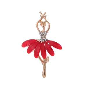 Macro detail of ballerina brooch with red resin petals and white rhinestone crystals