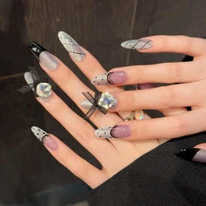 Purple cat eye press-on nails with 3D black bows, rhinestones and lattice patterns