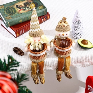 Christmas Santa and Snowman plush figurines with woven fruit baskets for festive table decor