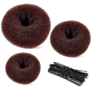 Three dark brown bun makers in various sizes with black U-shaped hair pins on white background
