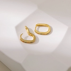 Elegant gold U-shaped hoop earrings featuring multi-color zircon stones on white background